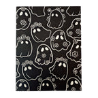 Greeting card with pattern of black daisy ghosts with white outlines on a black card background