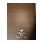 A2 brown greeting card back side with logo for The Weathered Vane.