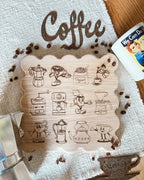 Scalloped wooden cutting board with retro coffee illustrations engraved in the wood. 